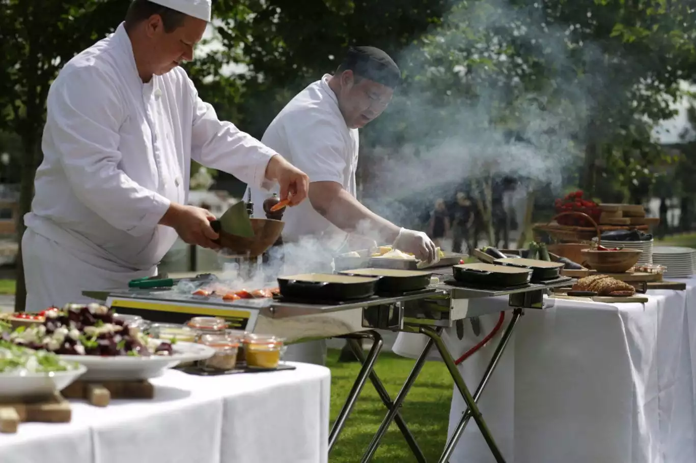 chefs serving a bbq on the terrace, runnymede on thames