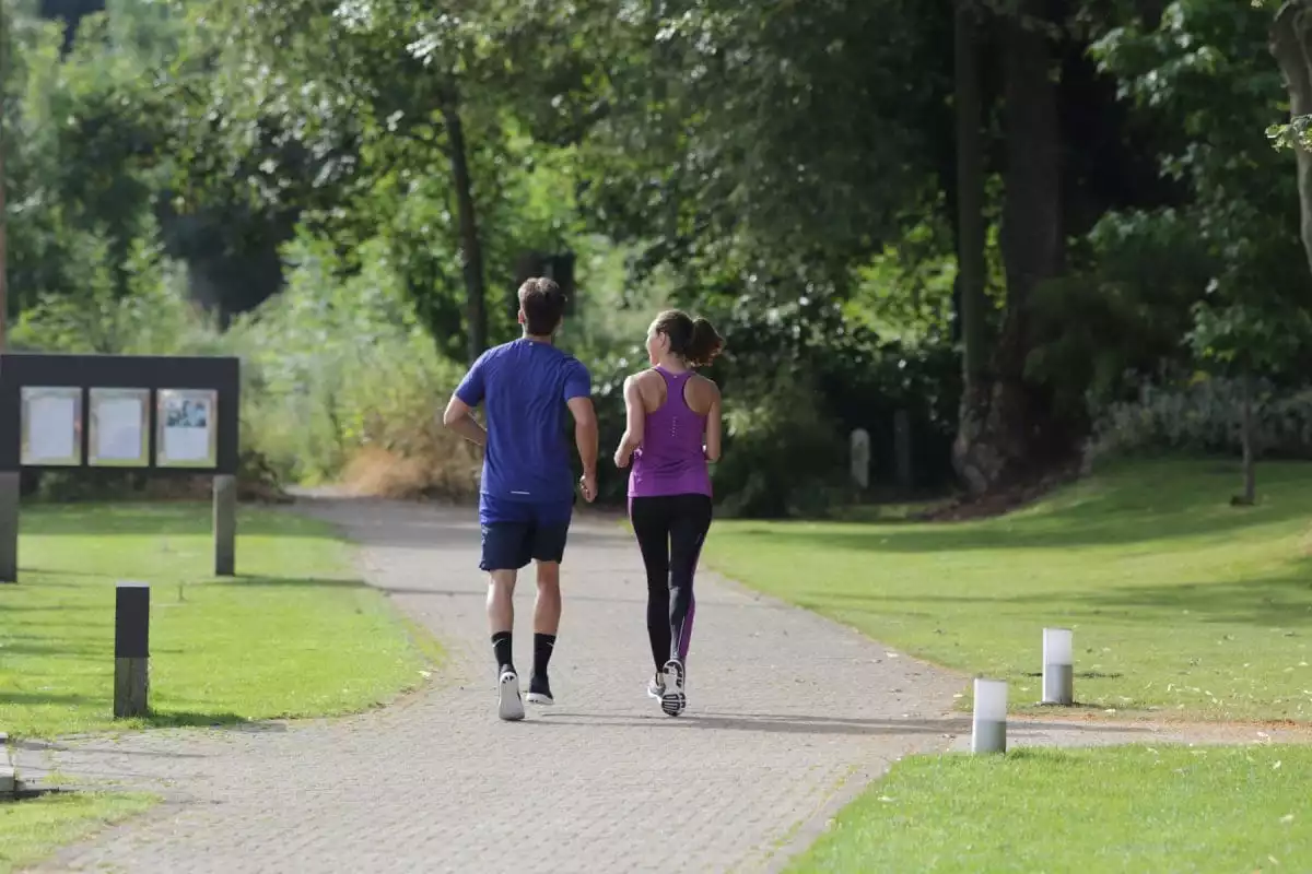 couple out running on the towpath, runnymede on thames