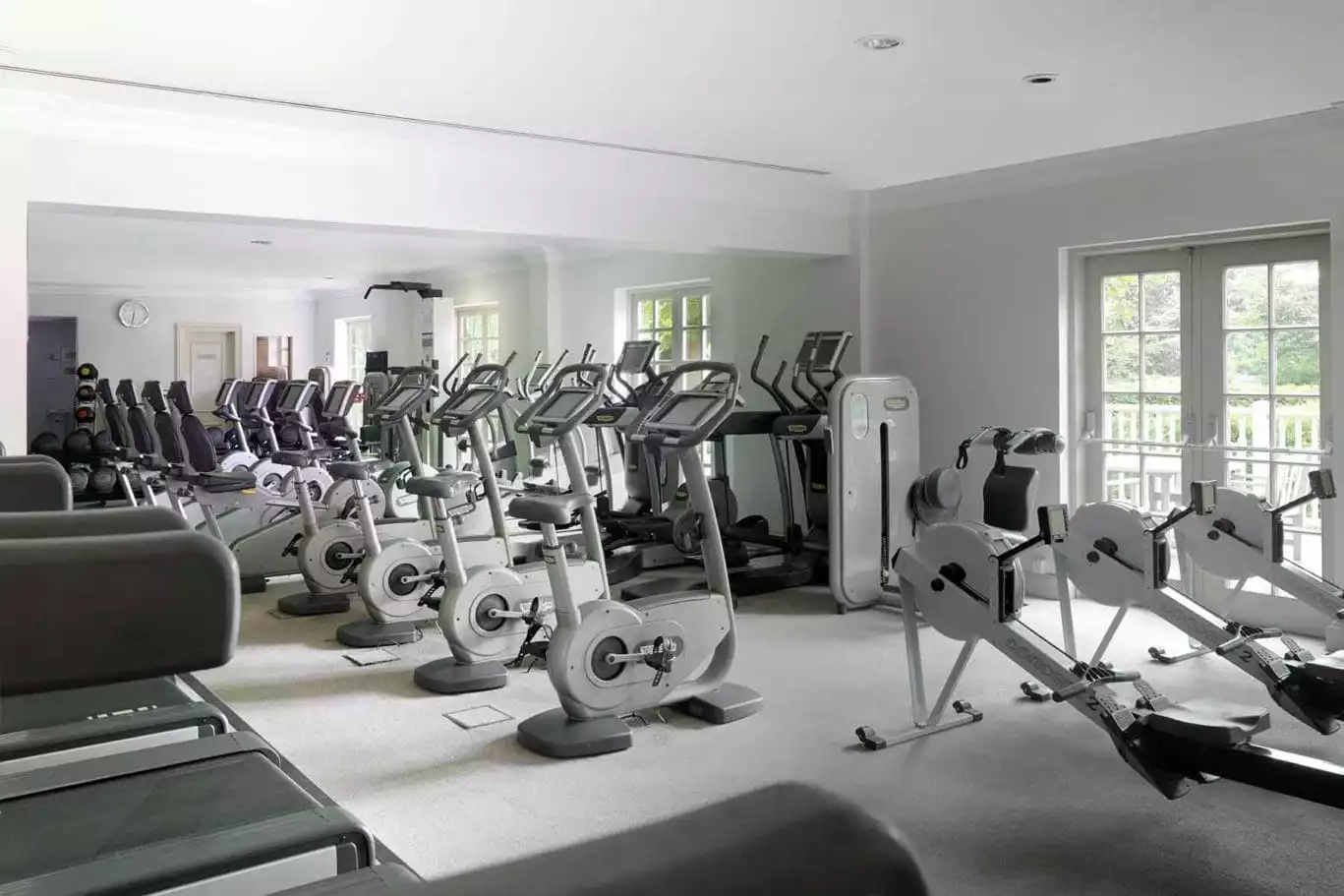Indoor bikes and rowing machines in the gym at The Runnymede on Thames