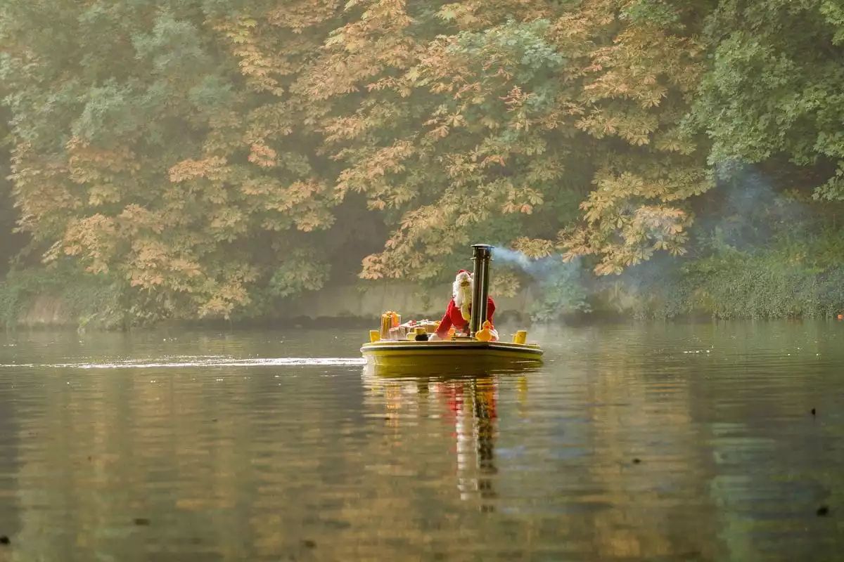 Image of father christmas in a hot tug on the River Thames